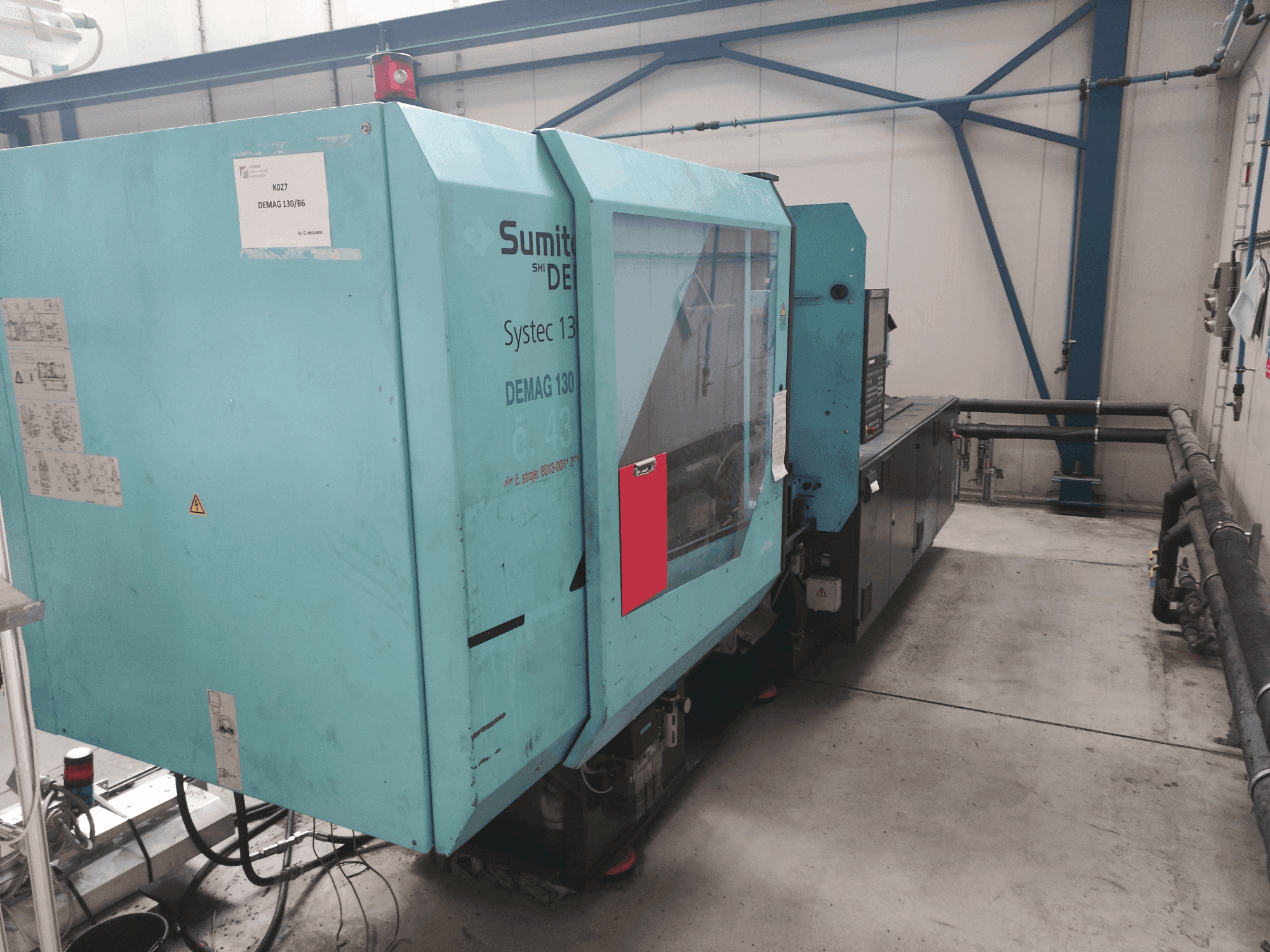 Frontansicht der DEMAG Systec 130/475-430 Maschine